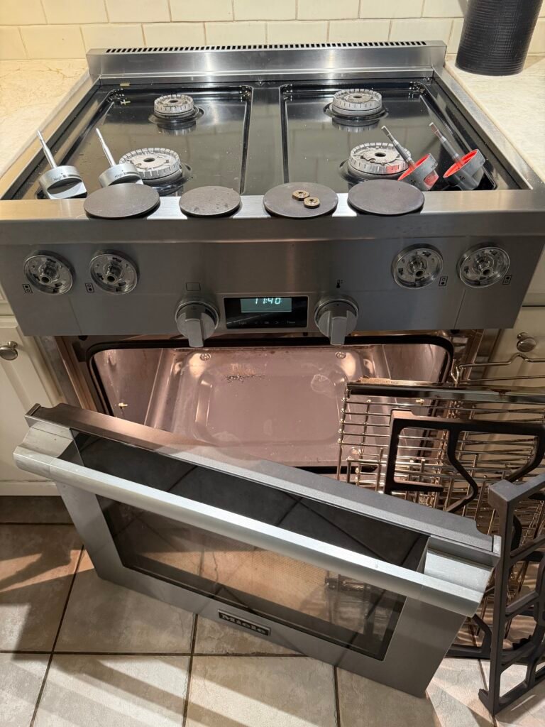 Miele four‑burner gas oven taken apart for professional deep cleaning and precision detailing