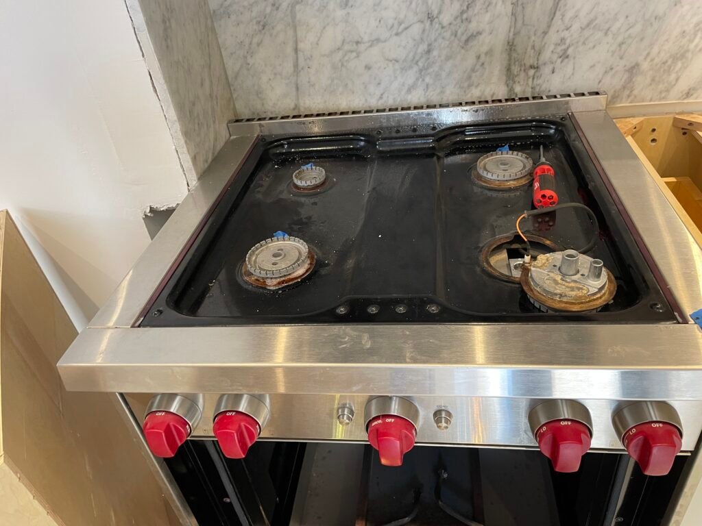 Luxury Wolf single gas oven featuring four burners, premium stainless steel design