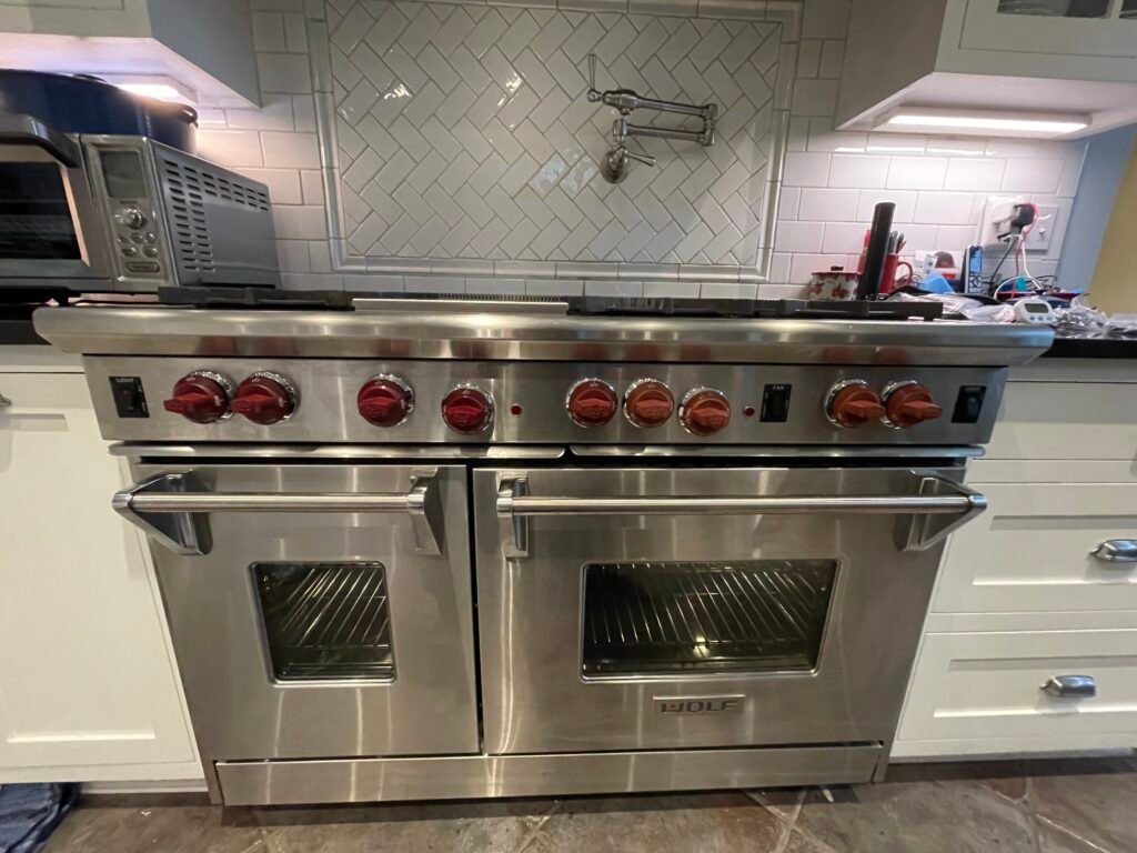 High-end Wolf professional range, stainless steel exterior detail cleaned and polished for pristine finish