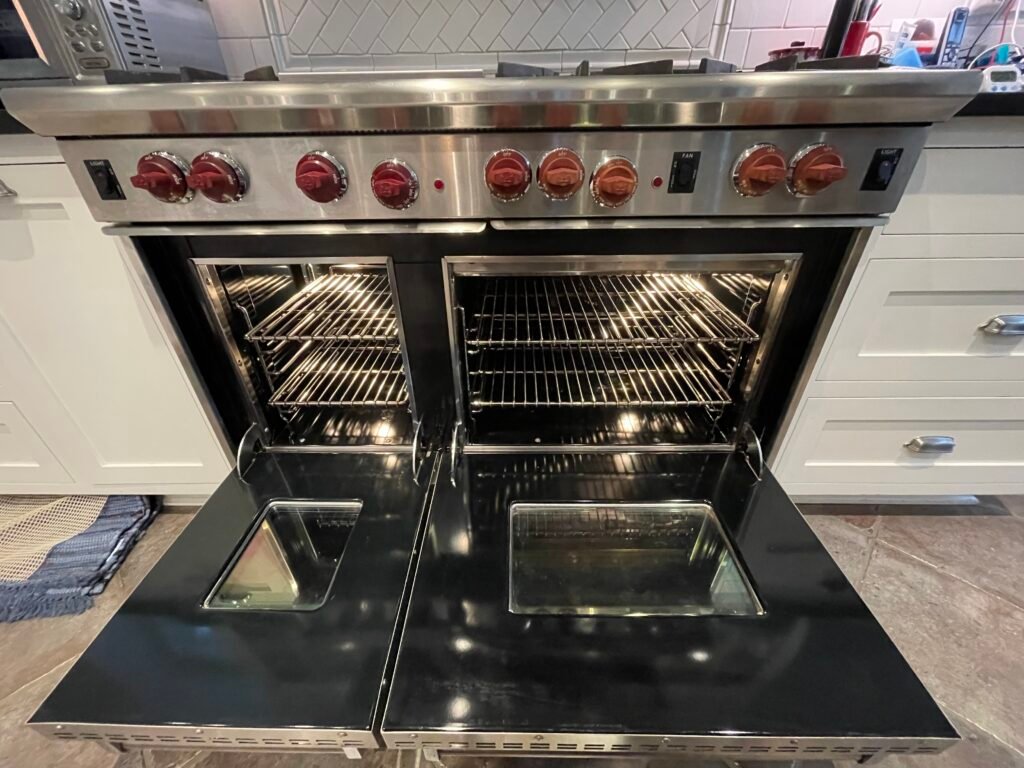 Luxury 48-inch Wolf cooking range with double oven, premium stainless steel design