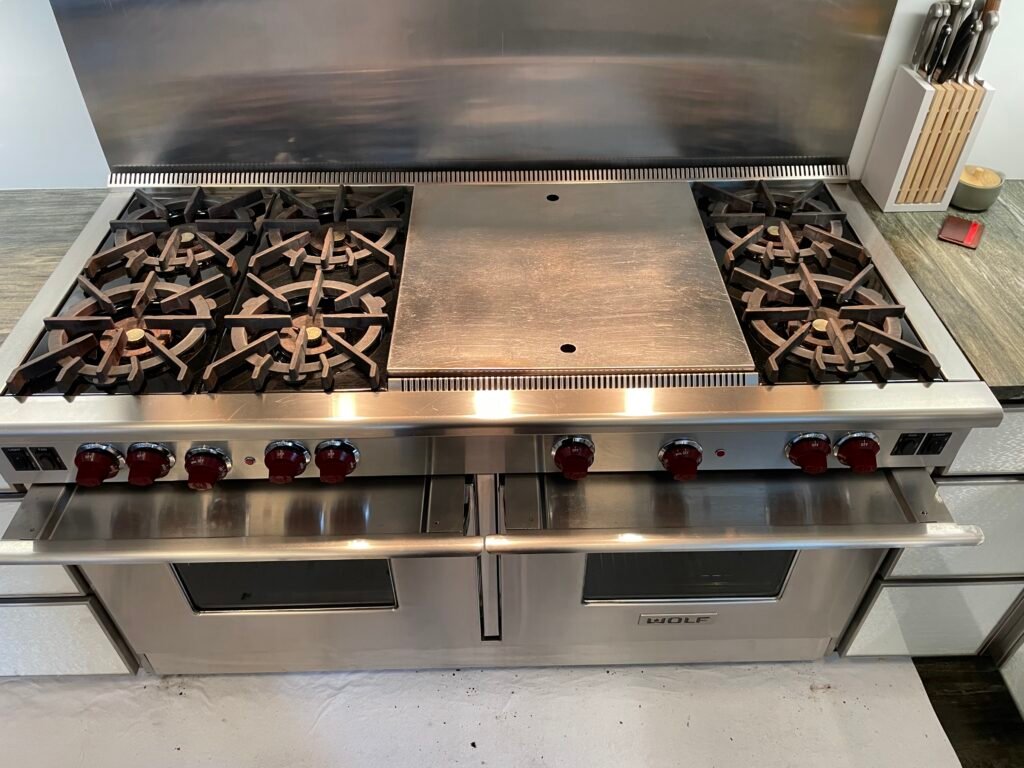 Luxury Wolf professional cooking range restored to brilliance after expert deep cleaning service