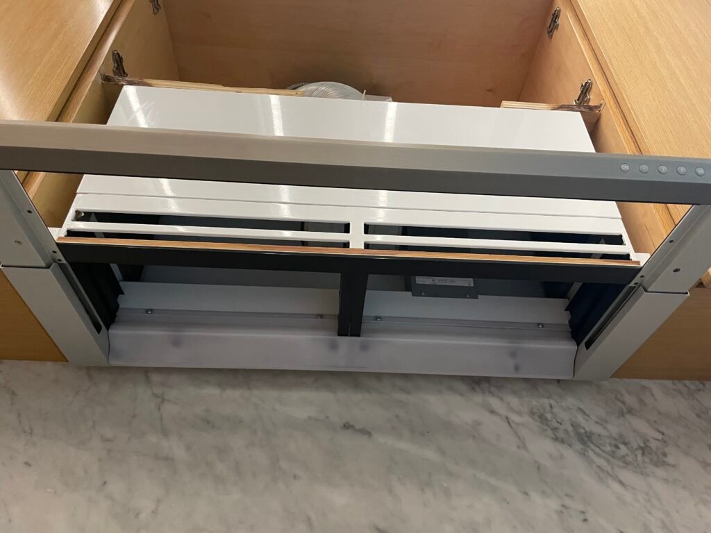 Built‑in Gaggenau 30-inch pull‑out range hood detailed during professional deep cleaning