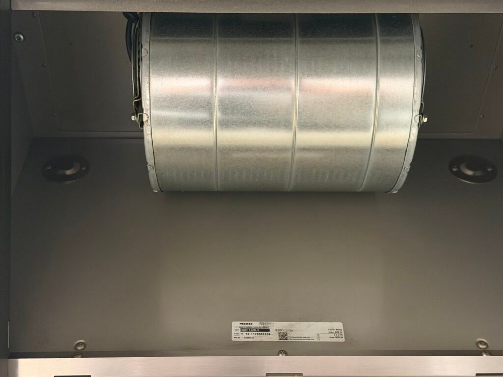 Blower component of range hood restored and polished after grease removal