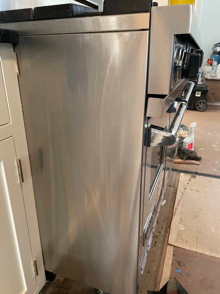 Side‑by‑side comparison of a Viking cooking range before and after OvenPal’s professional deep cleaning New York City, showing significant buld up of grease, grime, and residue that completely removed from the side of the appliance