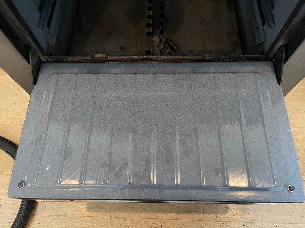 Spotless oven door after professional deep cleaning and luxury detailing service.