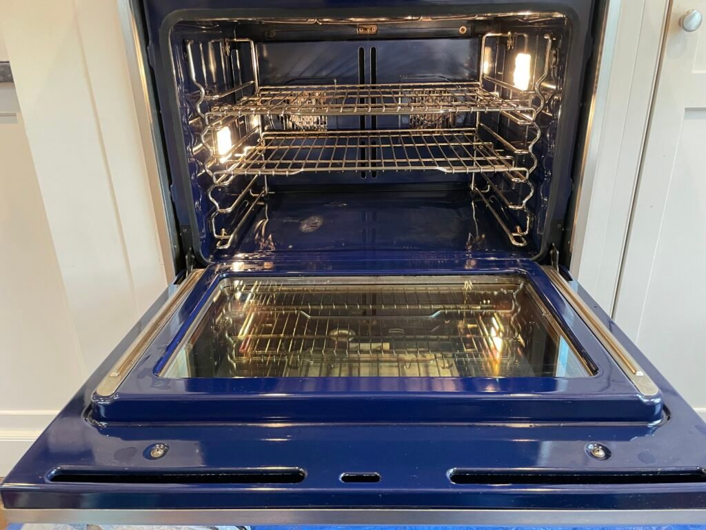 Spotless Wolf built‑in electric oven interior after professional deep cleaning and luxury detailing service.