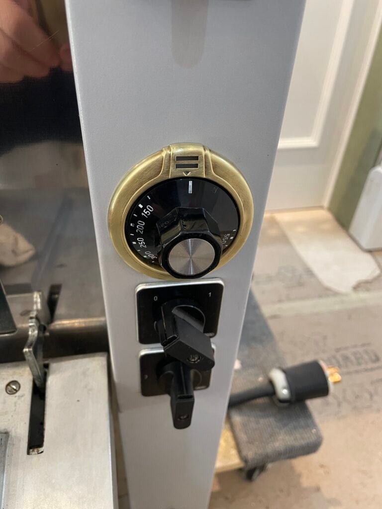 La Cornue brass bezel and control knob polished after deep Oven cleaning and luxury detailing service.