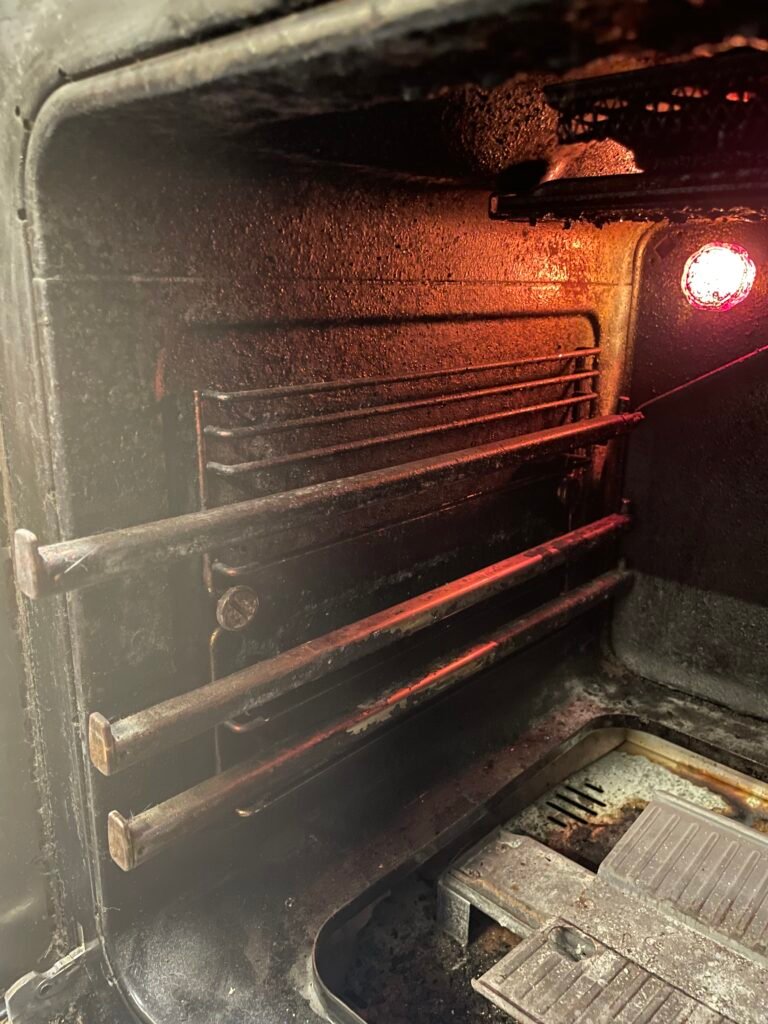 Side‑by‑side comparison of a Fisher & Paykel cooking range before and after OvenPal’s professional deep cleaning in New York City, showing significant buld up of grease, grime, and residue before our professional cleaning