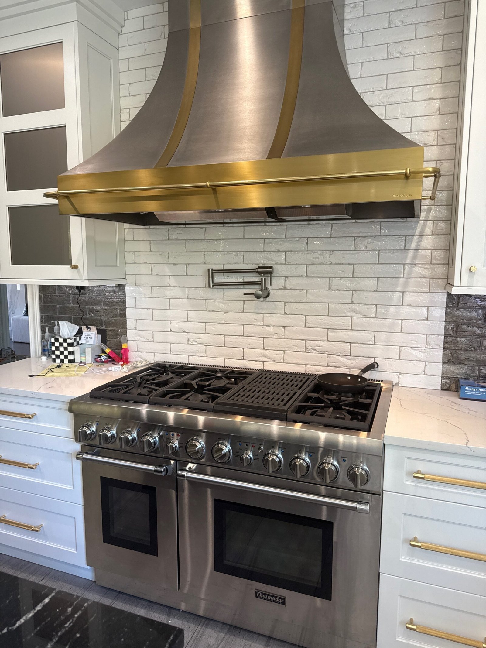 Ultra‑luxury La Cornue range hood with brass trims, meticulously cleaned and restored to brilliance— luxury appliance deep cleaning