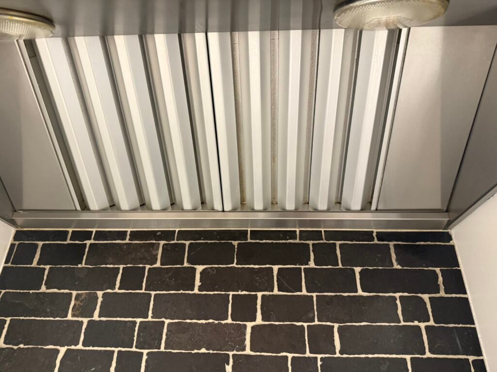 Wolf professional 30" range hood with heating lamps undergoing deep cleaning service