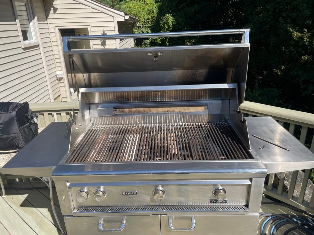 Lynx grill restoration in Queens with fully degreased ceramic briquettes and polished stainless steel.